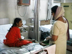 Female Chaplain Visiting With Patient